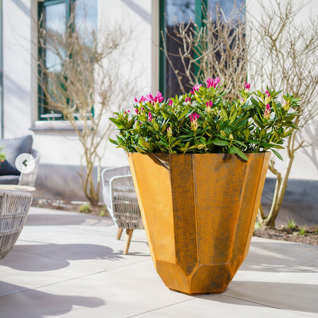 Corten steel facet planter on a contemporary patio