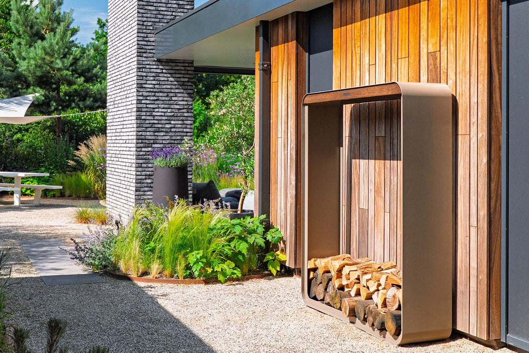 Forno Serra Powder Coated Aluminium log store outside a modern house