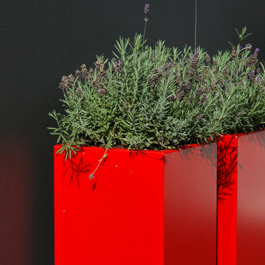 Close-up view of the Adezz Carrez Aluminium Tower Planter, showcasing its sleek vertical lines and modern design, perfect for outdoor spaces.