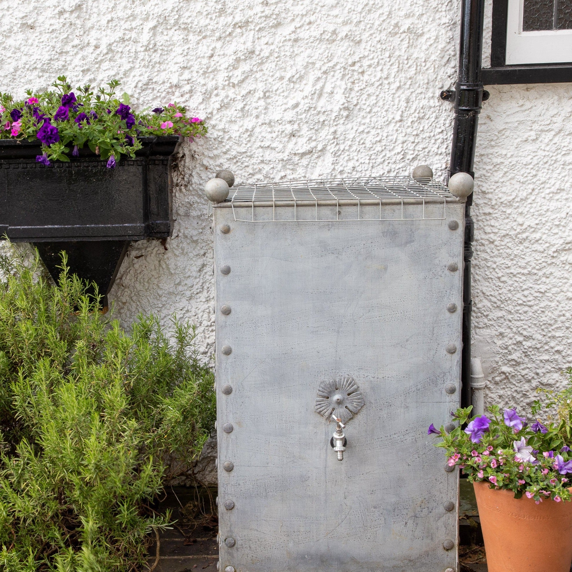 A large 330-liter galvanized steel water butt with a hose-ready brushed chrome tap. (7702905290945)